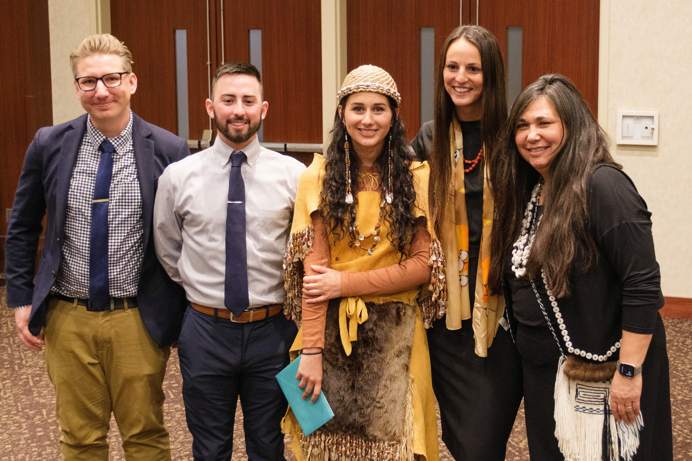 Dr. Mary Owen stands with four 2022 UMN Native American Medical School Graduates