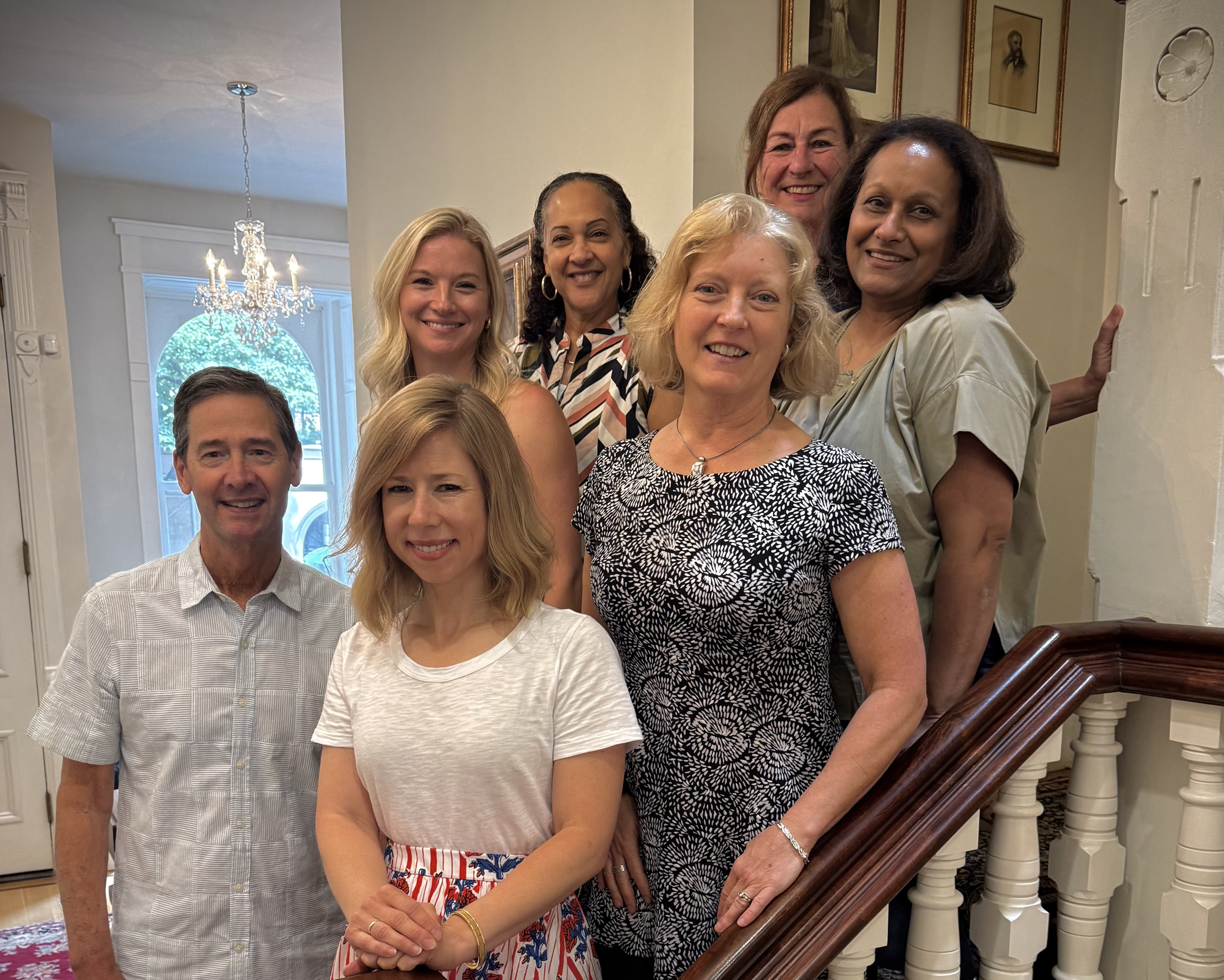 A photo of the Macy Foundation staff standing on staircase